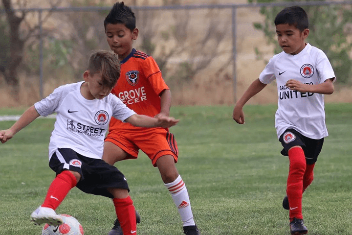 Boys team playing soccer